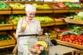 Senior woman holding phone and an apple Royalty Free Stock Photo