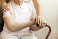 Close up of mature womans & nurse hands. Health care giving, nursing home. Parental love of grandmother. Old age related diseases. Royalty Free Stock Photo