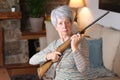 Senior woman holding a rifle