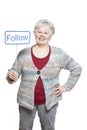 Senior woman holding a social media sign smiling Royalty Free Stock Photo