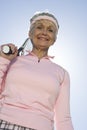 Senior Woman Holding Tennis Racquet