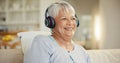 Senior woman, home and headphones for music, listening to audio and radio podcast on sofa. Happy elderly lady, relax and Royalty Free Stock Photo