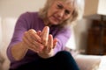 Senior Woman At Home In Pain Suffering With Arthritis Royalty Free Stock Photo