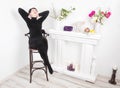 Senior woman at home sitting on modern chair and relaxing Royalty Free Stock Photo