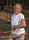 Senior woman hoola hooping Royalty Free Stock Photo