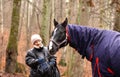 senior woman and horse Royalty Free Stock Photo