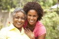 Senior Woman Hugging Adult Daughter