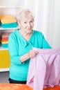 Senior woman ironing shirt Royalty Free Stock Photo