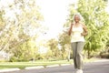 Senior Woman Jogging In Park