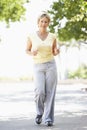 Senior Woman Jogging In Park