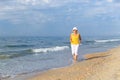 Senior woman jogging on sea beach Royalty Free Stock Photo