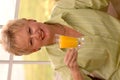 Senior woman with juice Royalty Free Stock Photo