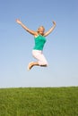 Senior woman jumping in air Royalty Free Stock Photo