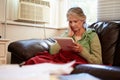 Senior Woman Keeping Warm Under Blanket With Photograph Royalty Free Stock Photo