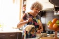 Senior woman with kettle pouring hot water into cup Royalty Free Stock Photo