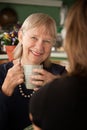 Senior woman in kitchen with daughter or friend