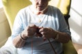 Senior woman knitting for hobby at home Royalty Free Stock Photo