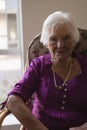 Senior woman looking at camera in nursing home Royalty Free Stock Photo