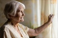 Senior woman looking out of window Royalty Free Stock Photo