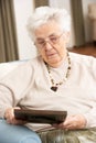 Senior Woman Looking At Photograph Royalty Free Stock Photo