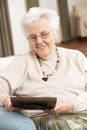 Senior Woman Looking At Photograph In Frame Royalty Free Stock Photo