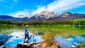 Senior woman looking at Pyramid Mountain in Pyramid Lake in Jasper National Park Royalty Free Stock Photo