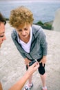 Senior woman looking smart watch with her coach Royalty Free Stock Photo