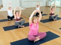 Active senior woman practicing yoga at group Royalty Free Stock Photo