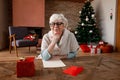 Senior woman making a wish to Santa Royalty Free Stock Photo