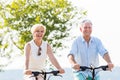 Senior woman and man at bicycle tour