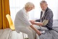 Senior woman and man measuring blood pressure, check health condition Royalty Free Stock Photo