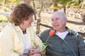 Senior Woman with Man Wearing Oxygen Tubes