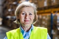 Senior woman manager or supervisor standing in a warehouse. Royalty Free Stock Photo