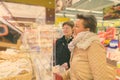 Senior woman and mature woman shopping at the grocery store together Royalty Free Stock Photo