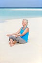 Senior Woman Meditating On Beautiful Beach Royalty Free Stock Photo