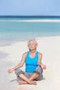 Senior Woman Meditating On Beautiful Beach Royalty Free Stock Photo