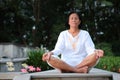 Senior woman meditation on park