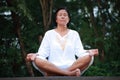 Senior woman meditation on the quiet park