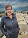 Senior Woman Model Poses on Breakwater at Samoset Resort in Rockland Maine