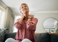 Senior woman, neck pain and stress in living room home of spine injury, fibromyalgia and osteoporosis. Sick, tired and Royalty Free Stock Photo