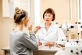 Senior woman ophthalmologist with patient in the office Royalty Free Stock Photo