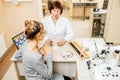 Senior woman ophthalmologist with patient in the office Royalty Free Stock Photo