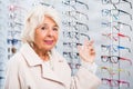 Senior woman in optician store