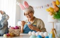 Senior woman painting eggs Royalty Free Stock Photo