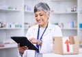 Senior woman, pharmacist and tablet for inventory inspection or stock in logistics at pharmacy. Mature female person in Royalty Free Stock Photo