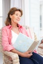 Senior woman with photo album Royalty Free Stock Photo