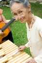 Senior woman play music