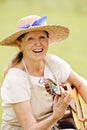 Senior woman playing guitar outdoors