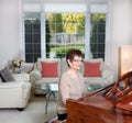 Senior woman playing her piano with happiness Royalty Free Stock Photo