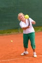 Senior woman playing tennis Royalty Free Stock Photo